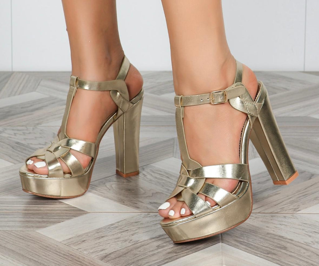 Women’s champagne gold metallic strappy platform sandals with high block heel and adjustable ankle strap.
