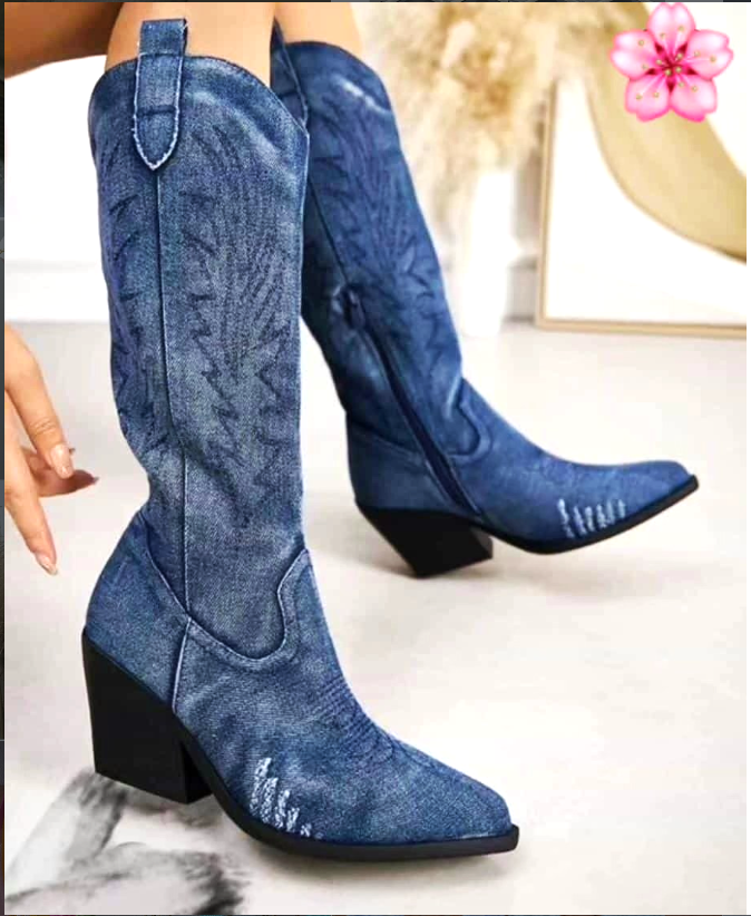 Women’s denim blue knee-high cowboy boots with embroidered stitching and block heel