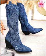 Women’s denim blue knee-high cowboy boots with embroidered stitching and block heel